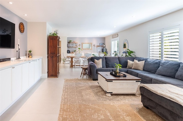 living area featuring light tile patterned floors and recessed lighting