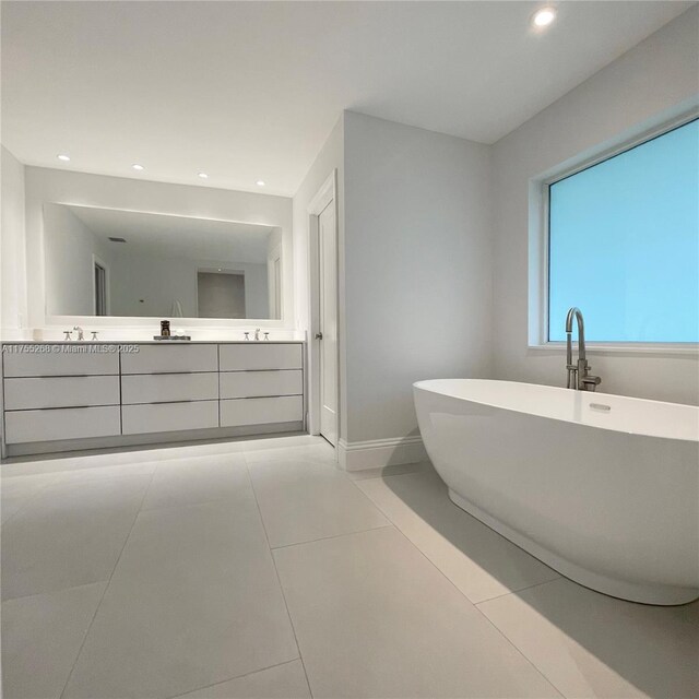 8513 SW 169th Ter, Palmetto Bay, FL 33157 - bathroom with tile patterned floors, a freestanding tub, double vanity, and recessed lighting
