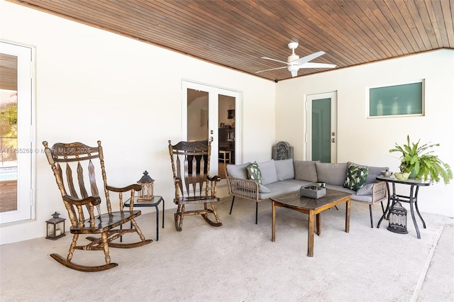 view of patio featuring french doors, ceiling fan, and an outdoor living space