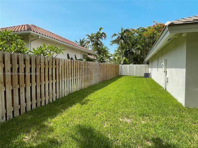 8513 SW 169th Ter, Palmetto Bay, FL 33157 - view of yard with central AC and a fenced backyard