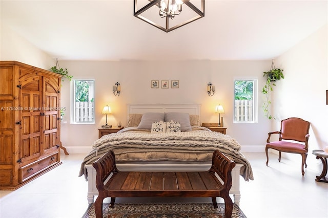 bedroom with multiple windows and baseboards