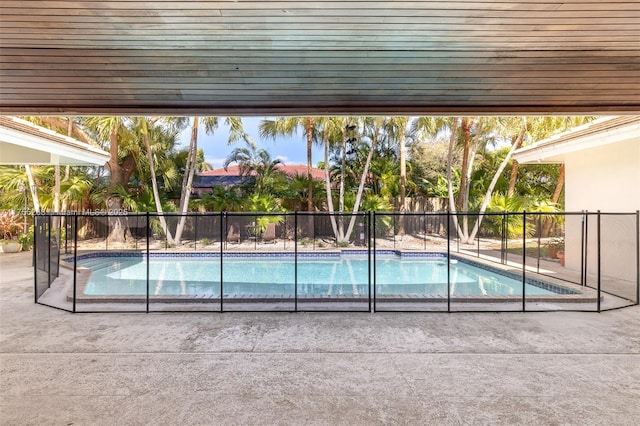 view of swimming pool featuring a fenced in pool, fence, and a patio