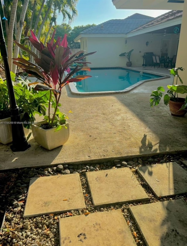 outdoor pool featuring a patio area