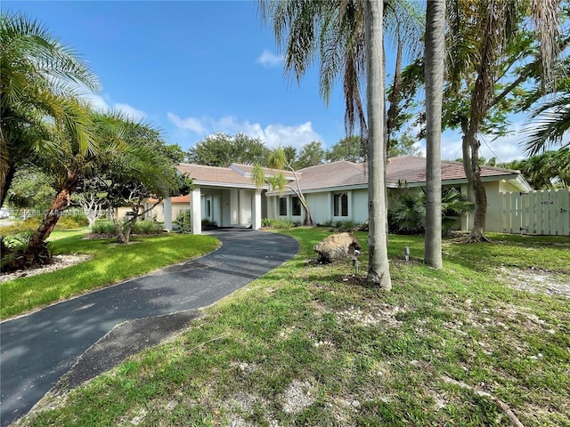 8513 SW 169th Ter, Palmetto Bay, FL 33157 - view of front of property featuring aphalt driveway, stucco siding, a front yard, and fence