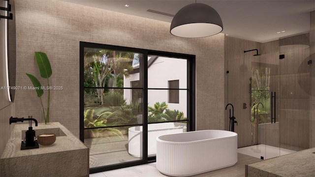 full bath featuring a freestanding tub and tiled shower