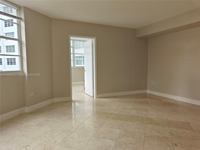 empty room with baseboards