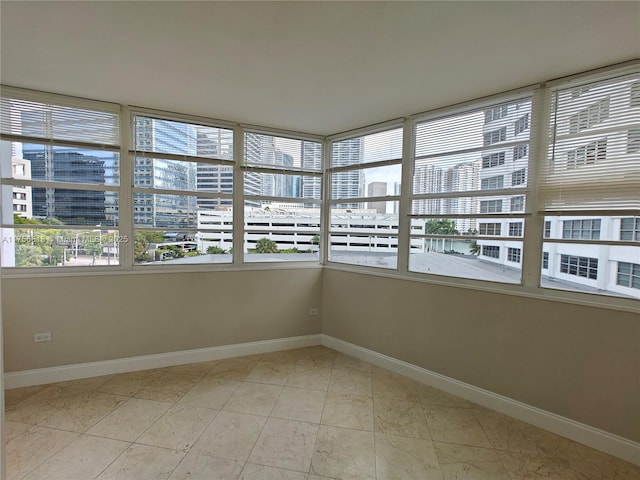 unfurnished sunroom with a view of city