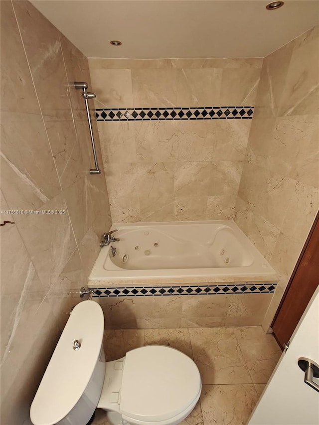 full bathroom featuring a combined bath / shower with jetted tub, tile walls, and toilet