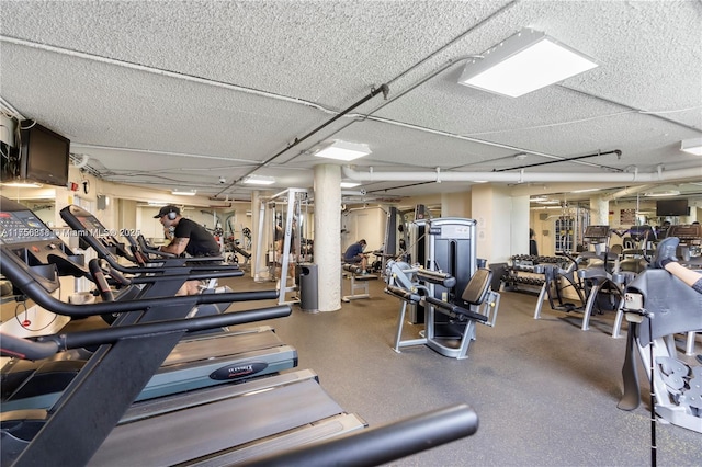 gym featuring a textured ceiling