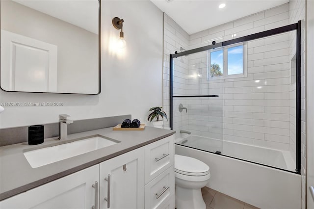 9705 SW 57th St, Cooper City, FL 33328 - bathroom featuring toilet, tile patterned floors, enclosed tub / shower combo, and vanity