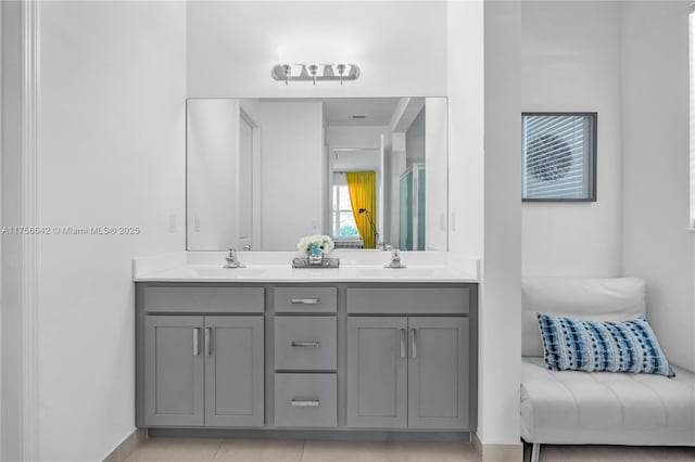 full bathroom featuring double vanity and a sink