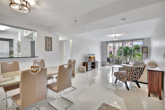 dining room featuring baseboards and light tile patterned flooring