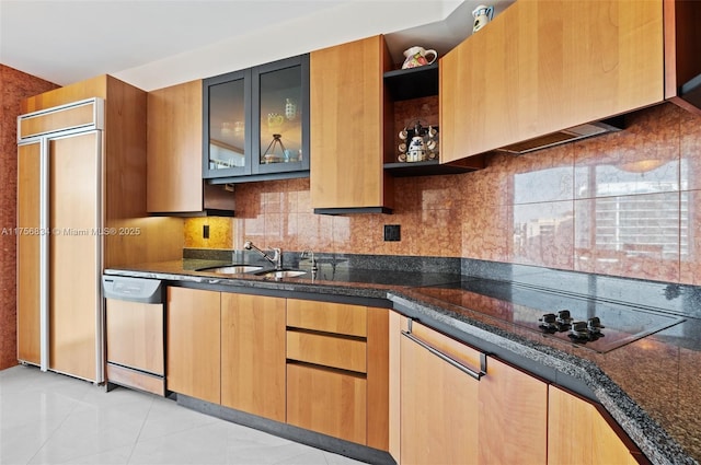 kitchen with black electric stovetop, a sink, backsplash, dishwasher, and dark stone countertops