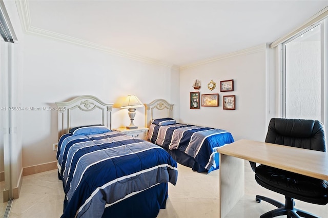 bedroom with crown molding and baseboards