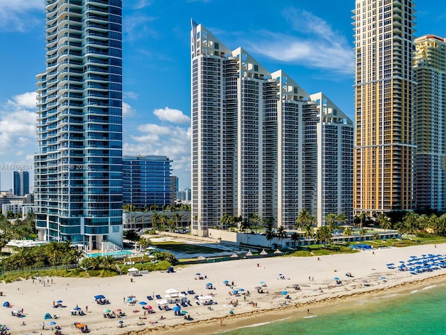 view of city with a water view and a view of the beach