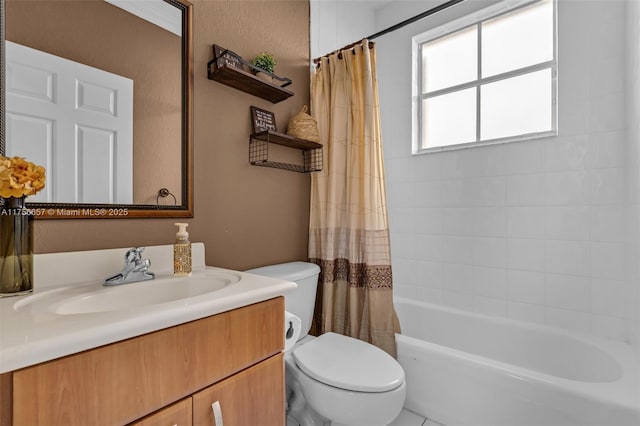 full bath with toilet, vanity, shower / tub combo, and a textured wall