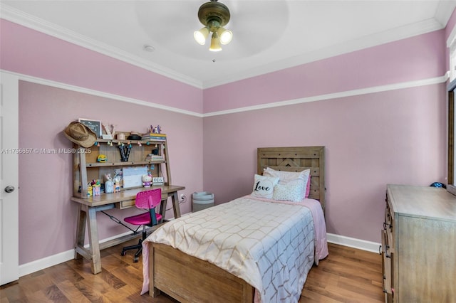 bedroom with ceiling fan, baseboards, wood finished floors, and ornamental molding