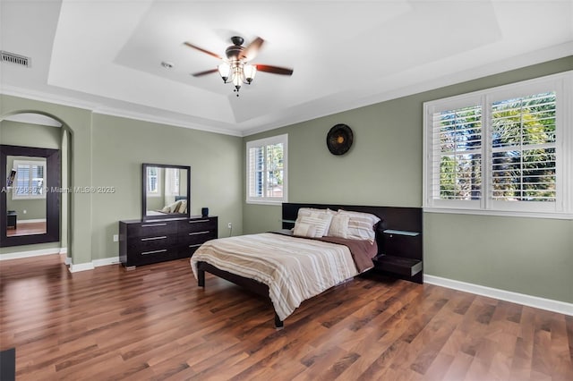 15509 SW 139th Ct, Miami, FL 33177 - bedroom with a tray ceiling, wood finished floors, arched walkways, and ceiling fan