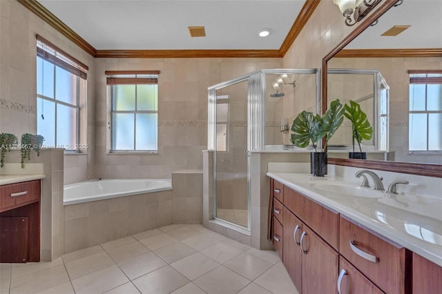 full bathroom with vanity, crown molding, a stall shower, and tile patterned floors