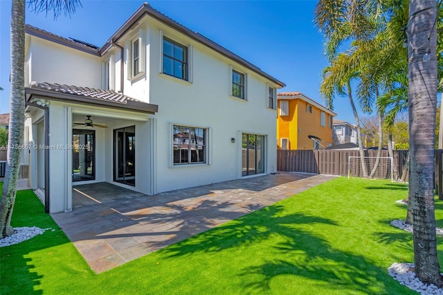 15509 SW 139th Ct, Miami, FL 33177 - back of house with stucco siding, a ceiling fan, and a patio area