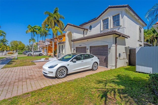 view of property exterior featuring stucco siding, driveway, fence, a yard, and an attached garage