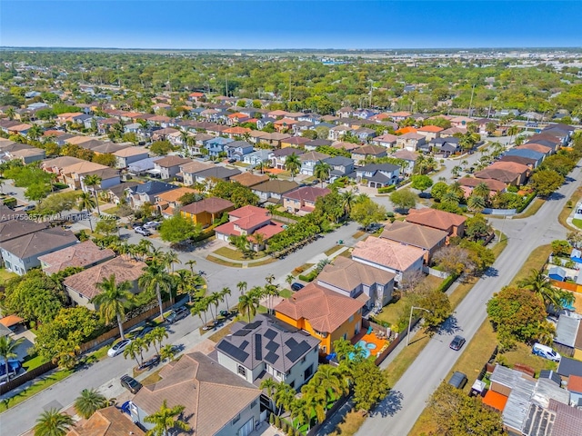 birds eye view of property with a residential view