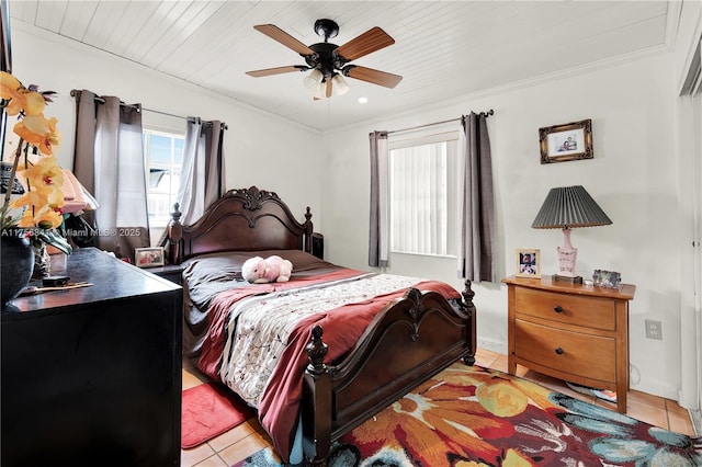 bedroom with a ceiling fan, light tile patterned flooring, and crown molding