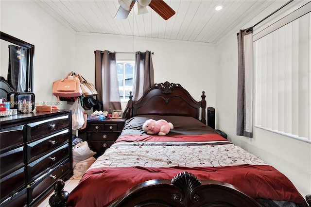 bedroom with wood ceiling and ceiling fan