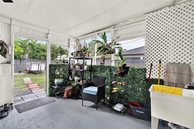 sunroom / solarium with a sink