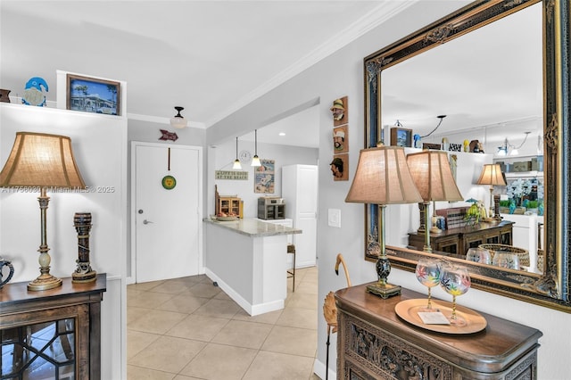 interior space featuring ornamental molding and light tile patterned flooring