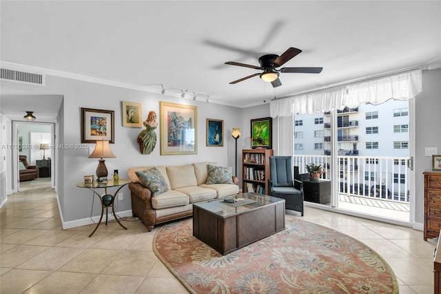 living area featuring crown molding, visible vents, and tile patterned floors