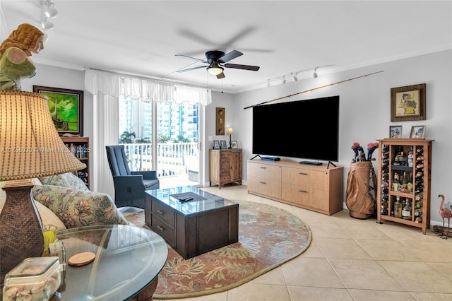 living room featuring ornamental molding, ceiling fan, track lighting, and light tile patterned floors