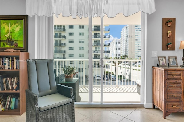 living area featuring tile patterned flooring and a view of city