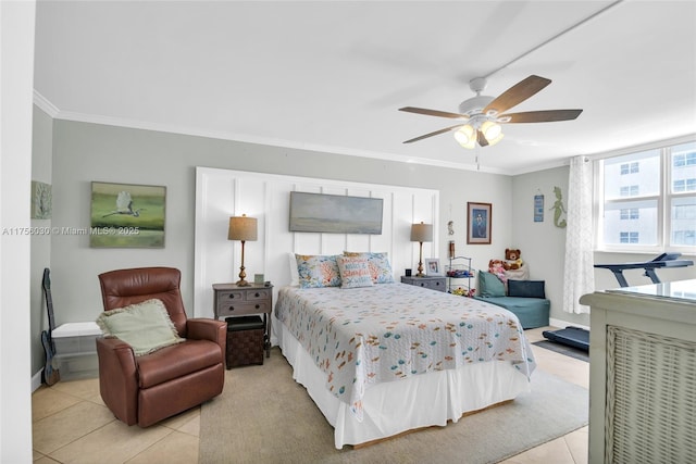 bedroom with a ceiling fan, light tile patterned flooring, crown molding, and baseboards