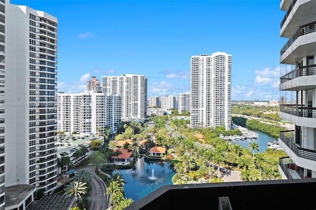 exterior space with a water view and a city view
