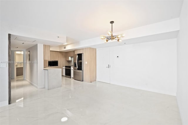 kitchen featuring stainless steel fridge, range, modern cabinets, open floor plan, and light countertops