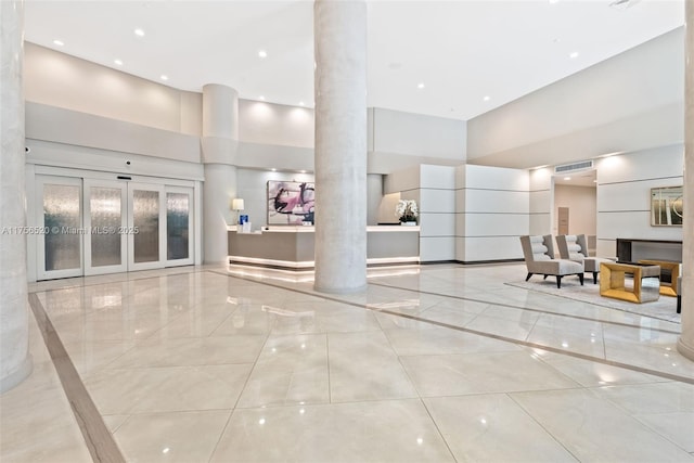 reception area with visible vents and ornate columns