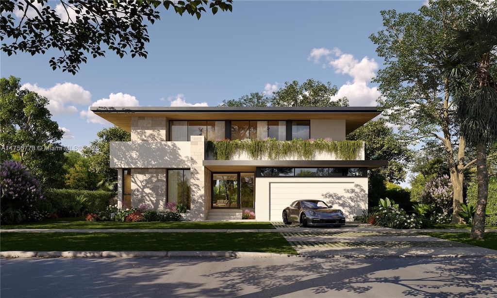 view of front facade featuring a front lawn, decorative driveway, an attached garage, and stucco siding