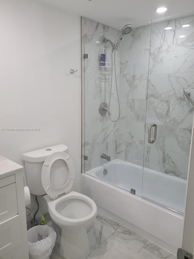 full bath featuring marble finish floor, bath / shower combo with glass door, recessed lighting, toilet, and vanity