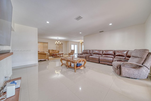 tiled living room featuring a chandelier, visible vents, and recessed lighting