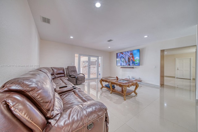 living room featuring recessed lighting, visible vents, french doors, and light tile patterned flooring