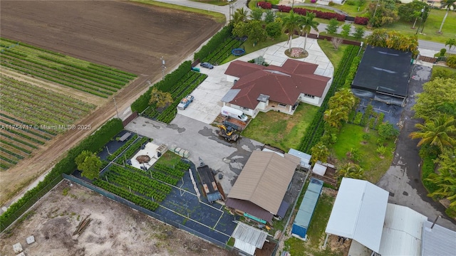 birds eye view of property with a rural view
