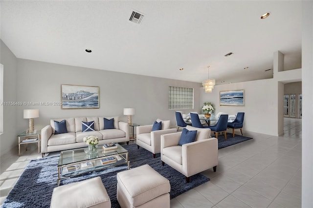 living area with light tile patterned flooring, visible vents, and recessed lighting