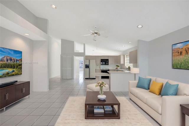 living room with light tile patterned floors, a ceiling fan, and recessed lighting