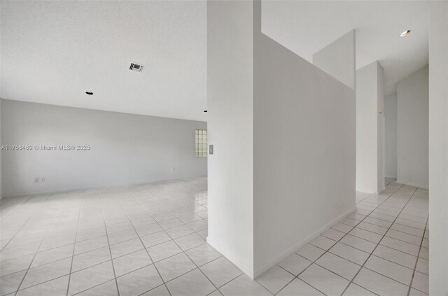 9820 SW 154th Pl, Miami, FL 33196 - hall featuring light tile patterned floors and visible vents