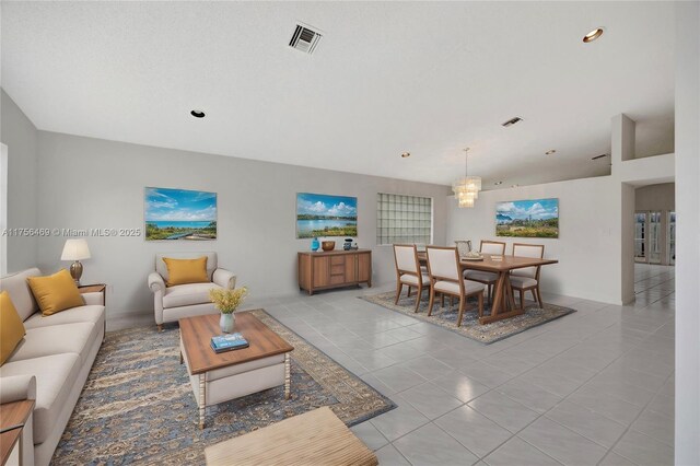 9820 SW 154th Pl, Miami, FL 33196 - living room featuring tile patterned flooring, visible vents, and a chandelier