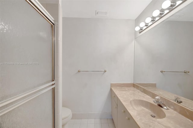 bathroom featuring tile patterned flooring, toilet, vanity, visible vents, and an enclosed shower