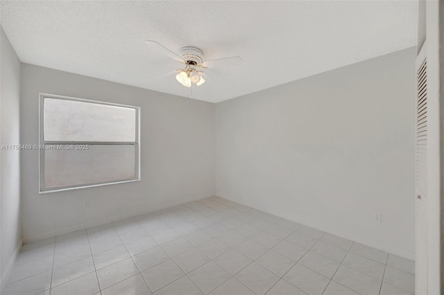 spare room featuring a ceiling fan