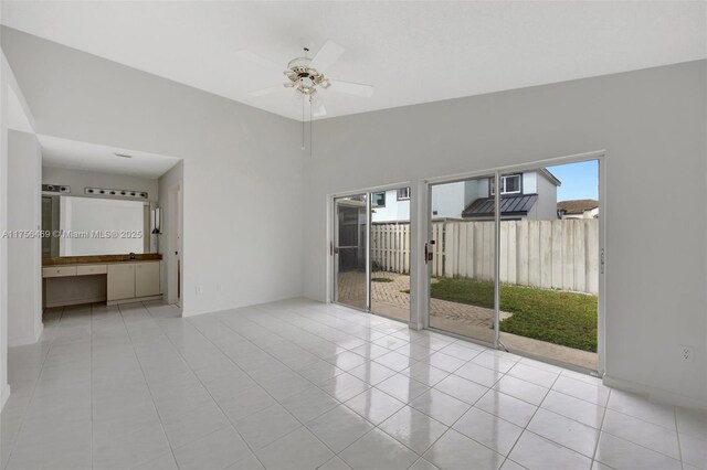 9820 SW 154th Pl, Miami, FL 33196 - unfurnished room featuring tile patterned flooring, vaulted ceiling, and a ceiling fan