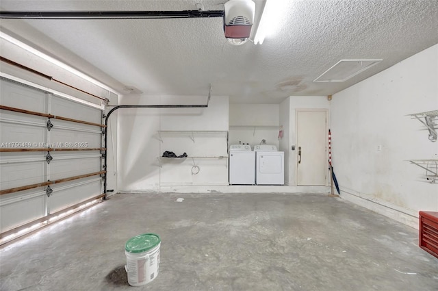 garage featuring a garage door opener and washer and clothes dryer